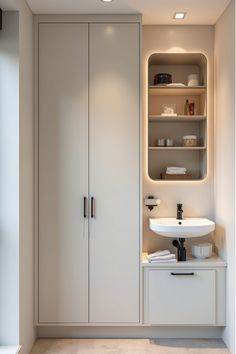 Vertical storage solutions complementing compact bathroom sink