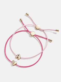 Give your mini the best of both worlds when you scoop up this two-in-one, super stackable bracelet set. The Kids' Cord Initial Bracelet Set will feature the initial of your choosing crafted in crystals and gold and sitting on a pink cord. We paired each initial with a matching heart bracelet, ensuring your little's bracelet stack will be extra meaningful. Please note: intended for children 3+. Matching Heart Bracelet, Fleece Hat Pattern, Bracelets For Kids, Ballerina Kids, Unicorn Earrings, Cream Earrings, Kids Headbands, Unicorn Kids, Gold Girl