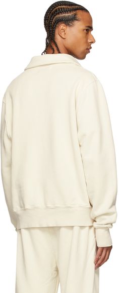 Long sleeve garment-dyed cotton fleece sweatshirt in off-white. Pre-shrunk. Spread collar. Dropped shoulders. Rib knit cuffs and hem. Supplier color: Ivory Casual Cream Sweats With Ribbed Cuffs, Cream Sweatshirt With Ribbed Cuffs For Loungewear, Relaxed Fit Cotton Sweater In Winter White, Winter White Cotton Crew Neck Sweater, Winter White Relaxed Fit Cotton Sweater, Winter White Cotton Sweater With Relaxed Fit, Winter White Cotton Sweater, Relaxed Fit, Fall Cream Cotton Sweats, Cream Cotton Sweater With Ribbed Collar