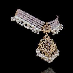 Showcase an epitome of elegance in tantalizing symphony of intricate craftsmanship and redefined traditions! A majestic set featuring a layout of beautiful CZ and pastel pink beads and stone work along with pearl embellishments. The set includes a necklace and a pair of beautiful earrings. Approximate earrings length is 3.5". Gold-plated on high-quality brass as base metal. Made by order. Kindly allow 5-7 weeks for the delivery of this item. For custom or urgent requests, please contact support@ Heritage Jewellery, Waist Chain, Stone Work, Head Accessories, Pink Beads, Guinea Bissau, Base Metal, Men's Collection, Pastel Pink