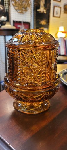 a glass bowl sitting on top of a wooden table