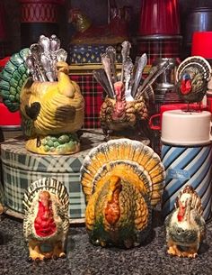 there are many turkey figurines on the counter