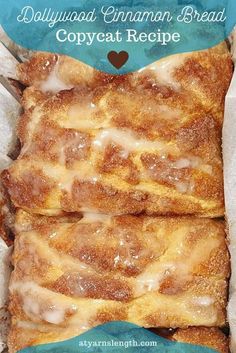 two pieces of cinnamon bread with icing in a blue and white paper wrapper