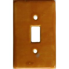 an orange light switch cover with two white buttons