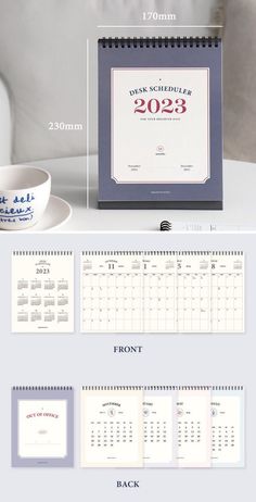 the desk calendar is next to a cup and saucer