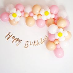 a happy birthday banner with balloons and flowers