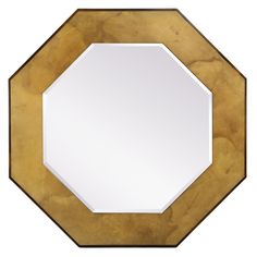 a mirror that is sitting on top of a wooden table with an octagonal shape in the middle