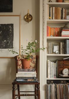 a chair and bookshelf in a room