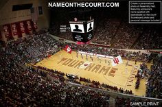 an aerial view of a basketball court with fans