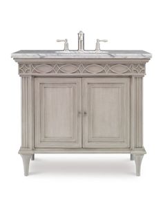 an antique style sink cabinet with marble top