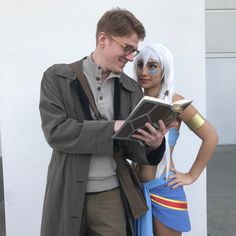 a man and woman are dressed up as cosplayes