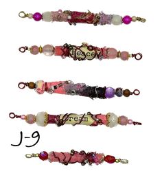 These Boho/Vintage/Gipsy style beads are hand crafted so each one is unique and individual with no one being exactly alike. Listing is for one set of 5 beads.  Beads have been wire wrapped and accented with tiny glass beads, metallic beads, wood beads, 2 beads per set will have a word,  Approximate Dimensions: Length : from smaller 2" to larger 3 1/4 in  Diameter : 1/4 to 3/8 in Bohemian Pink Oval Beaded Jewelry, Bohemian Pink Oval Bead Jewelry, Bohemian Pink Jewelry With Oval Beads, Pink Handmade Custom Beads, Unique Handmade Pink Beads, Pink Spacer Beads For Crafting, Spiritual Pink Spacer Beads, Bohemian Assorted Beads For Gifts, Large Spiritual Pink Beads