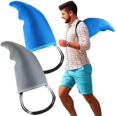 a man is running with two hats on his head and one has a shark tail