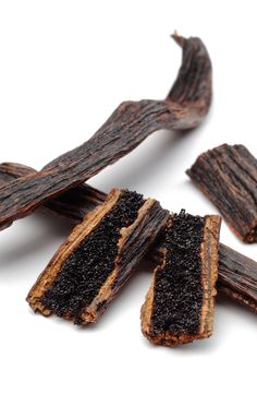 several pieces of dog treats on a white surface