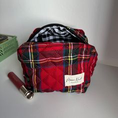 Our Holly Mini Makeup Bag is a stylish and compact carry-all designed to hold your essentials with a classic look.   The quilted exterior is made from a beautiful dark red checkered material, complemented by a classy black & white gingham interior.  Ideal for organizing your makeup and beauty essentials or serving as a travel organizer (especially when you need something more compact than our large bags), this is a must-have for anyone who values both organization and style.  Size: 6" x 4" x 5" Gingham Interior, Mini Makeup Bag, Red Checkered, Mini Makeup, Travel Organizer, Backpack Tote Bag, Toiletry Storage, Beauty Essentials, Tote Backpack