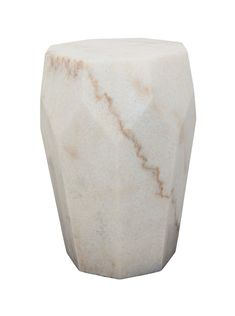 a white marble vase sitting on top of a table