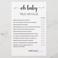 the oh baby true or false game is shown on top of a marble countertop