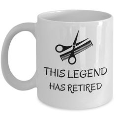 this legend has retired mug with scissors and combs on the front, in black