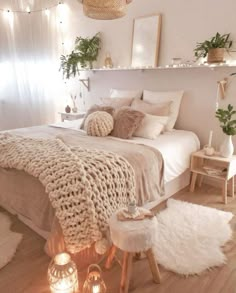 a bedroom decorated in neutral tones and white