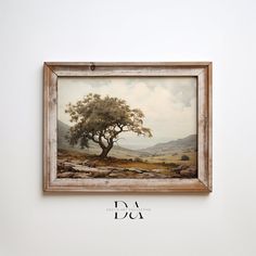 a painting hangs on the wall above a sign that reads daa daa, with an image of a tree and mountains in the background