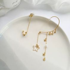 Dainty handmade no piercing mismatched ear wrap, ear cuff, ear climber, ear crawler. Sold as 1 pair. One side is dangling starry and pearl ear wrap, the other side is cz star cluster ear cuff. No ear hole necessary, easy to adjust and pair at your personal fit preference, super convenient. Gold plated sterling silver, sparkly dainty delicate earrings. Perfect as everyday jewelry, also looks gorgeous as party/bridal bridesmaid/wedding accessories! ♥ All of our jewelry are carefully handmade with Elegant Star Charm Cartilage Earrings, Elegant Star Shaped Cartilage Earrings With Star Charm, Star Shaped Ear Climbers As Gift, Star-shaped Ear Climbers For Pierced Ears, Star-shaped Ear Climbers As Gift, Star-shaped Ear Climbers For Gift, Minimalist Ear Cuff, Tassel Earing, Ear Crawler