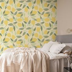 a bed sitting under a yellow and green wallpaper