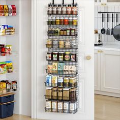 a pantry door is open to show the food in it and spices on the shelves