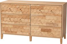 a wooden dresser with geometric designs on the front and drawers, all in natural wood