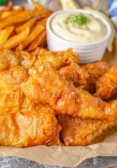 fried chicken and french fries with dip on the side