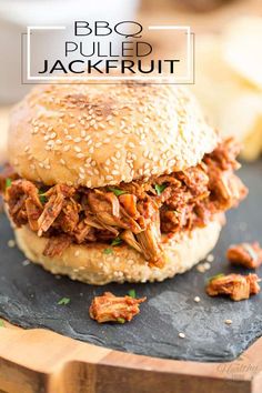 bbq pulled jackfruit on a bun with sesame seeds and garnish