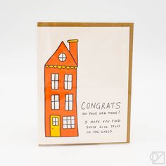 a card with an orange house on the front and words congrats written below