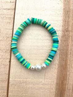 Green, blue, pearl clay beads Turquoise Pearl Beaded Round Beads Bracelets, Turquoise Beaded Pearl Bracelets, Turquoise Pearl Beaded Bracelets, Blue Bohemian Pearl Bracelet With Colorful Beads, Blue Pearl Beaded Bracelets For Beach, Blue Pearl Bracelet With Colorful Beads For Beach, Bohemian Blue Pearl Bracelet With Colorful Beads, Blue Beaded Pearl Bracelet For Beach, Blue Beaded Pearl Bracelet For The Beach