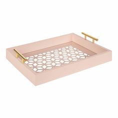 a pink tray with gold handles and a lattice design on the bottom, in front of a white background