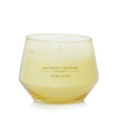 a candle that is inside of a glass on a white surface with the words ged berry lemonade in it