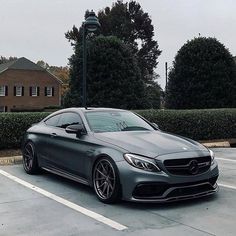 a grey car parked in a parking lot