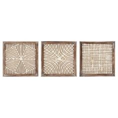 three framed artwork pieces with white and brown lines on them, one in the shape of a flower