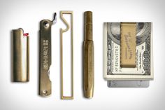 an assortment of different items including money, scissors and lighter