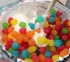 a bowl filled with gummy bears and ice cream