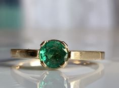 Yellow Gold Solitaire Emerald Ring For May Birthstone, Yellow Gold Solitaire Emerald Ring, May Birthstone, Solitaire Emerald Ring In Yellow Gold, May Birthstone, Green Round Band Emerald Ring For Anniversary, Green Emerald Ring With Round Band For Anniversary, Classic Green Emerald Ring In 14k Gold, Classic 14k Gold Green Emerald Ring, Heirloom Emerald Solitaire Ring, Heirloom Green Emerald Solitaire Ring