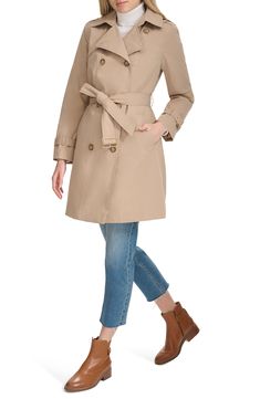 The ultimate all-season coat, this water-resistant trench has all the elements you want—a removable hood, an optional belt and a classic double-breasted silhouette. 37" length (size Medium) Double-breasted button closure Removable hood Belted cuffs Removable belt Front slant pockets Water resistant Lined, with polyester fill 100% polyester Machine wash, tumble dry Imported Hooded Trench Coat, Classic Trench Coat, Belted Trench Coat, Trench Coat Black, Quilted Coat, Black Sand, Trench Coats Women, Sand Color, Cole Haan