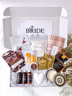 the bridal gift box is packed with all kinds of treats and condiments