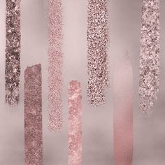 some pink and silver glitters are hanging from the side of a pole in front of a gray background