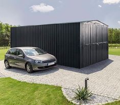 a car is parked in front of a black shed