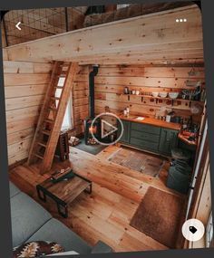 a living room with wooden walls and flooring in an attic style home on the tv screen