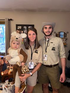 a man, woman and child are dressed up in costumes