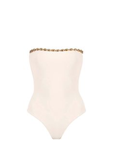 The Nancy in Latte by Seashell is a high cut One-Piece swimsuit. Dive into luxury with this strapless one-piece swimsuit adorned with opulent gold seashell hardware. Designed for the fashion-forward beachgoer, this swimsuit effortlessly combines elegance and allure.
 Size: S, M, XXL, L, XL Chic Bandeau Swimwear, Elegant Gold Swimwear For Poolside, Elegant Gold Swimwear For Beach, Chic Gold Swimwear For The Pool, Chic Gold Swimwear For Pool, Luxury One-piece Swimwear For The Beach, Elegant Gold Swimwear For Summer, Chic Strapless Swimwear For Beach Season, Elegant Evening Swimwear For Beach Season