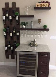 a wine rack with bottles and glasses on it