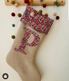 a christmas stocking hanging from a wooden rack