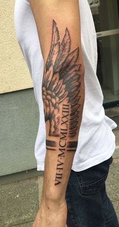 a man with a tattoo on his arm