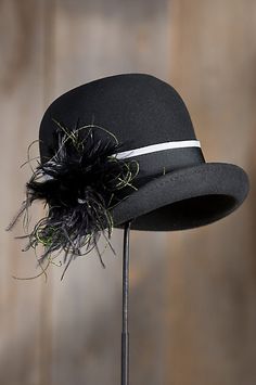 With its asymmetrical brim, wide two-tone ribbon hatband, and elegant tuft of… Unique Leather Jacket, Mad Hatter Hat, Pretty Hats, Flapper Hat, Luxury Boots, Mad Hatter Hats, Elegant Hats, Women's Hats, Cloche Hat